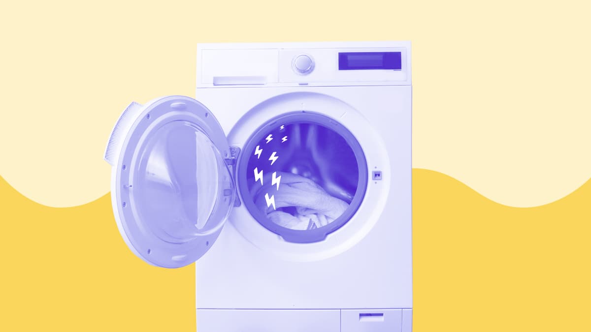 A photo illustration of a front-load washer/heat pump dryer combination machine with the door open and a solid yellow wave in the background.